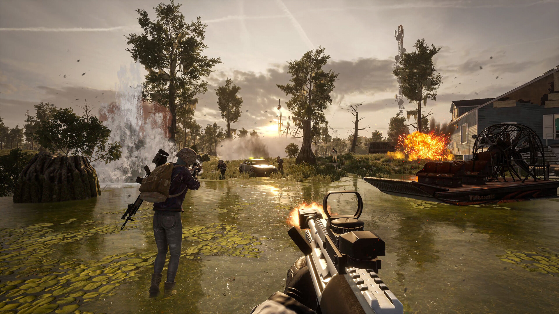 First-person view of a PUBG firefight in the Deston swamp: a rifle fires across shallow water as an explosion lights up an airboat by a stilt house